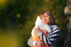 mother holding her daughter