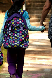 child with backpack